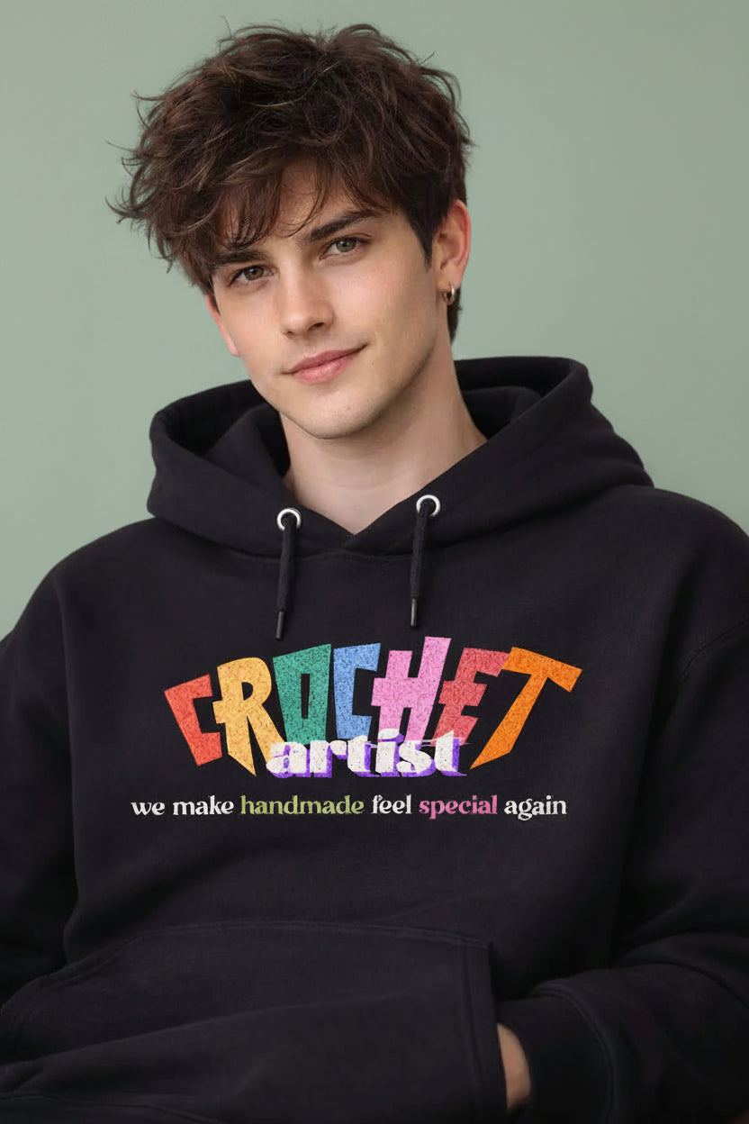 Person wearing a black hoodie with beautyful graphic