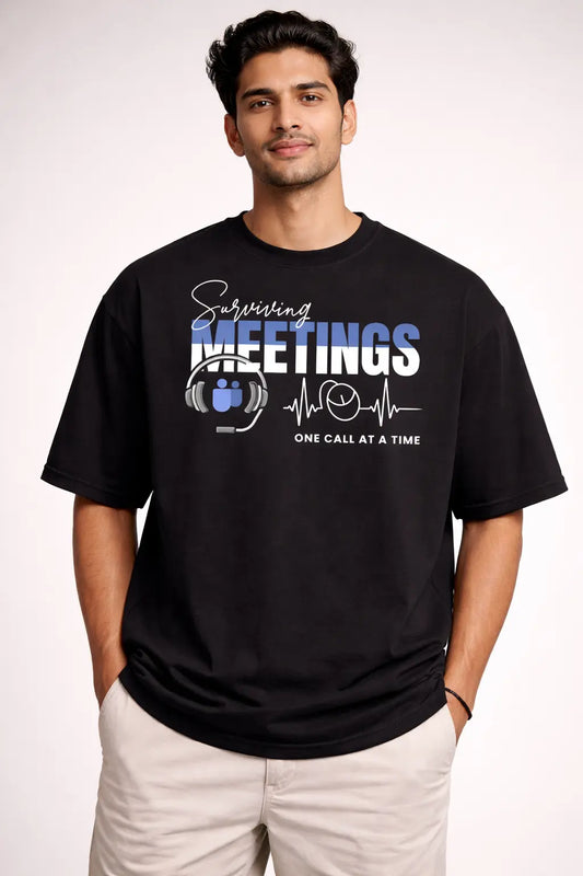 Man wearing a black  oversized t-shirt with humorous design and text.