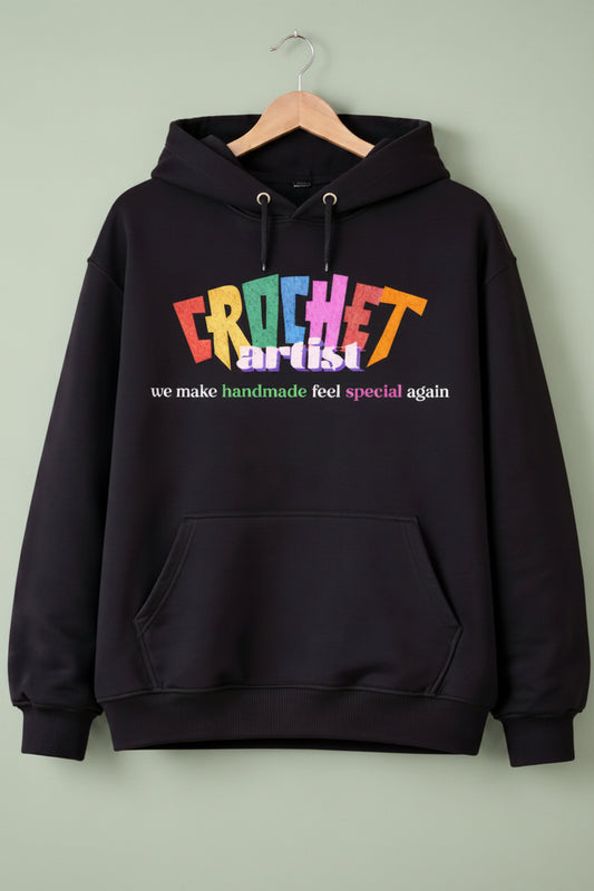 Black oversized hoodie with colorful text on a hanger
