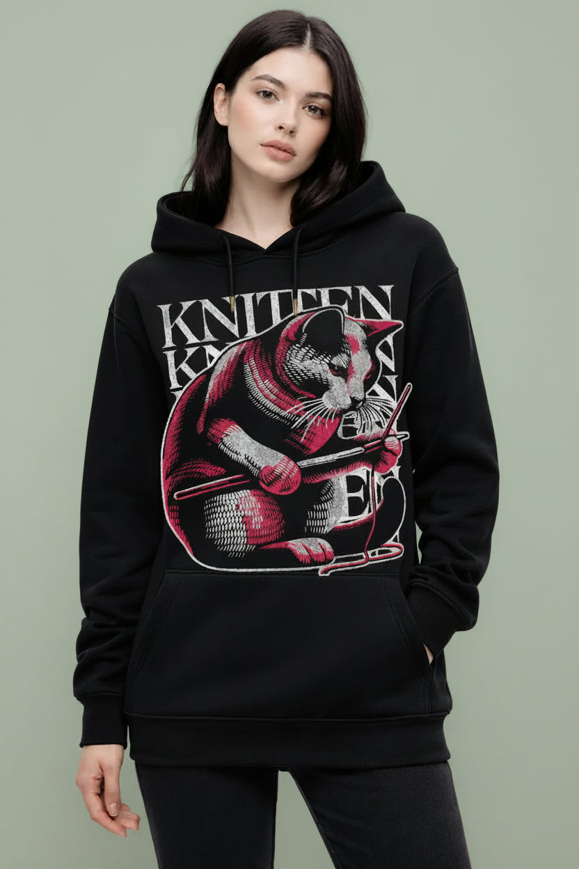  girl wearing a black oversized hoodie with unique knitten design 