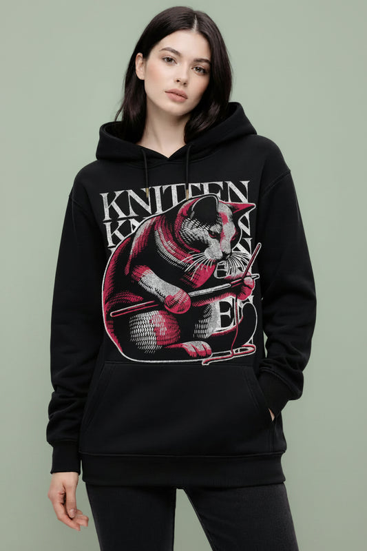  girl wearing a black oversized hoodie with unique knitten design 