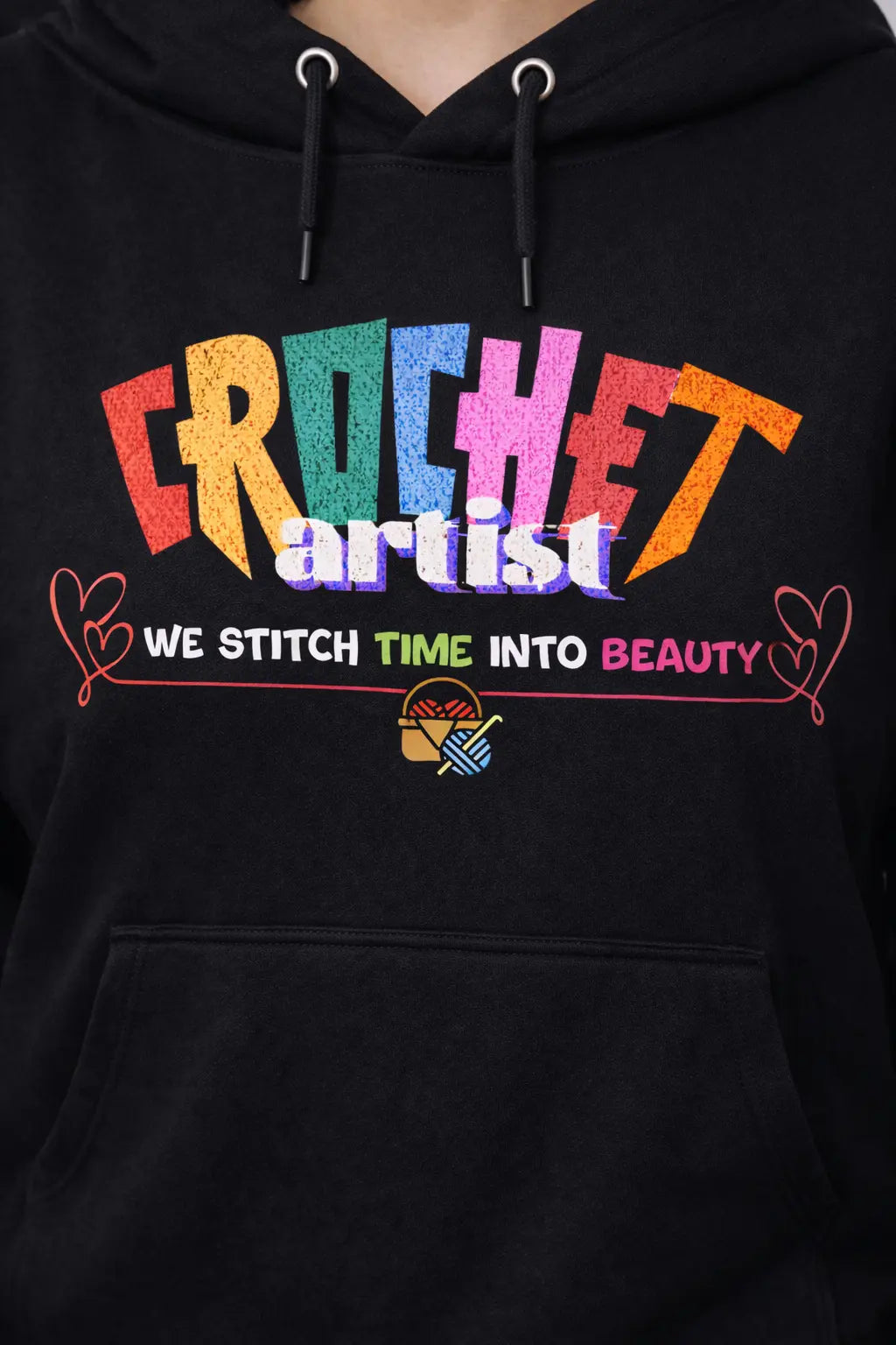 Black oversized hoodie with colorful 'Crochet artist' text on a closeup design