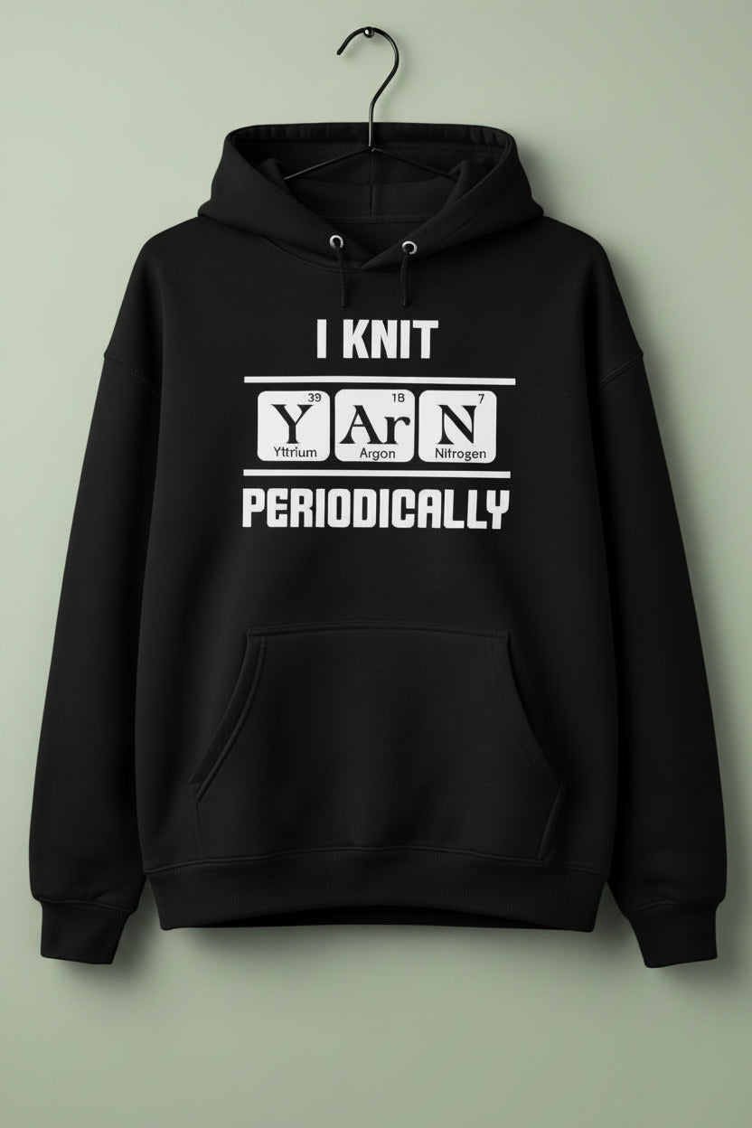 Black oversized hoodie with text 'I KNIT YARN PERIODICALLY' on a  hanger