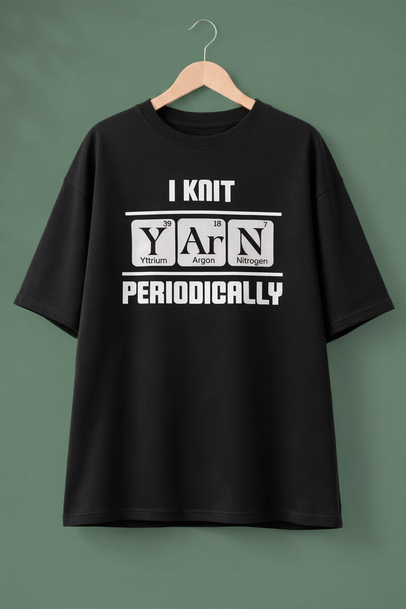 Black oversized t-shirt with white text on a hanger  