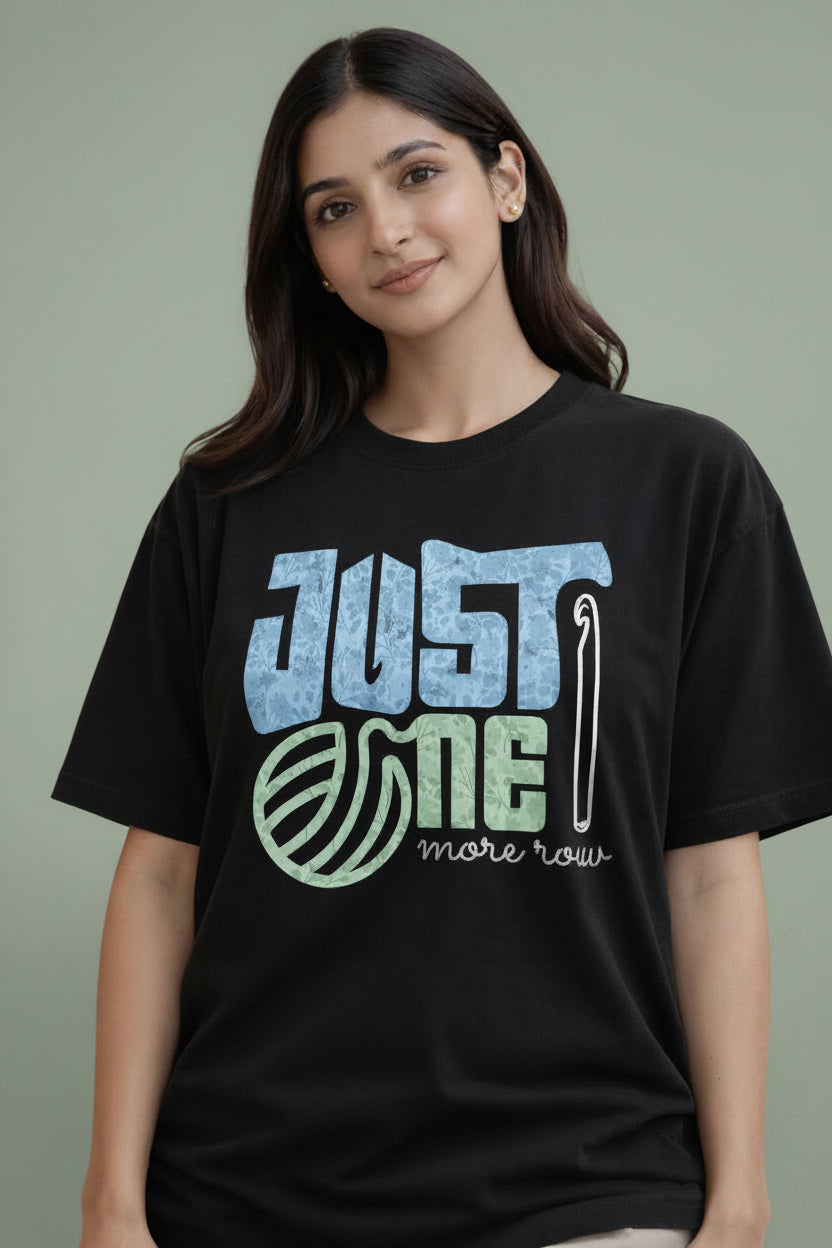 Woman wearing a black t-shirt with a colorful graphic design