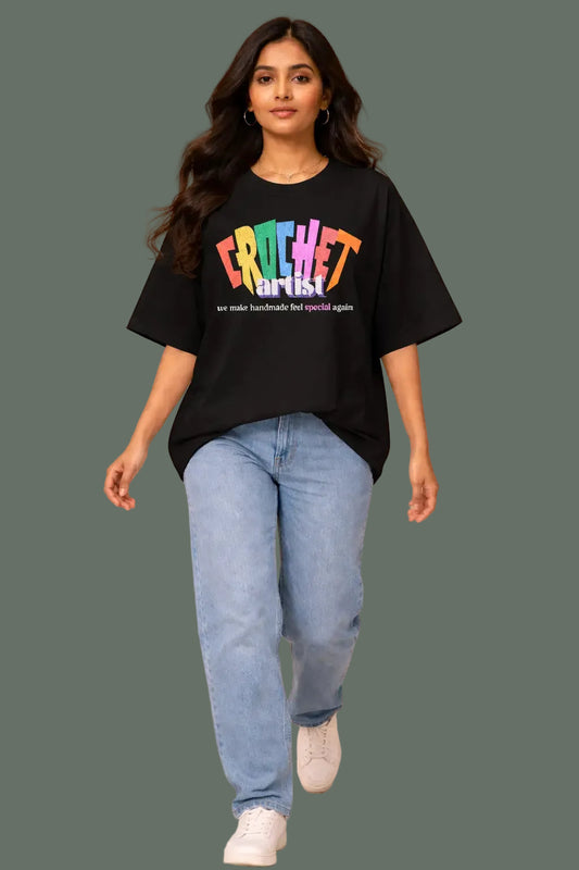 Woman wearing a black  oversized t-shirt with colorful text and good quality
